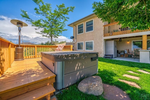 wooden deck featuring a yard, a patio, and fence