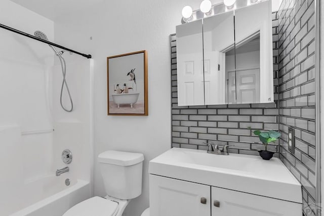 bathroom with toilet, tub / shower combination, backsplash, and vanity