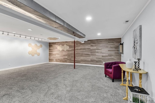 living area featuring baseboards, recessed lighting, carpet, and wooden walls