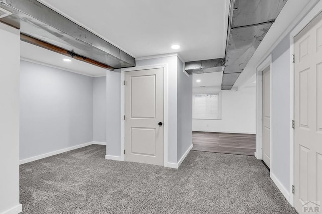 finished below grade area featuring carpet floors, recessed lighting, and baseboards