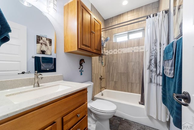 bathroom with toilet, shower / bathtub combination with curtain, and vanity