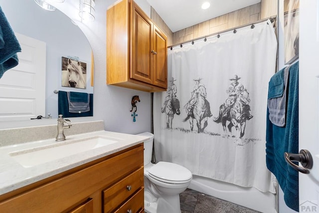 full bathroom with toilet, shower / tub combo, and vanity