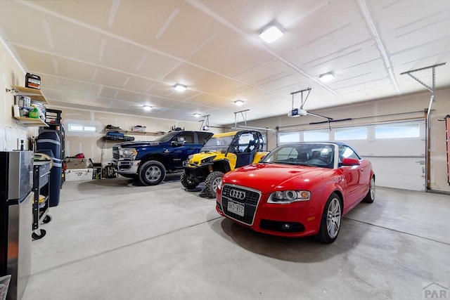 parking deck with freestanding refrigerator and a garage door opener