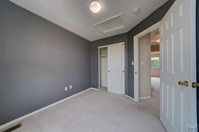 6292 Riverdale Dr, Colorado Springs, CO 80923 - unfurnished bedroom featuring attic access, carpet floors, and a closet
