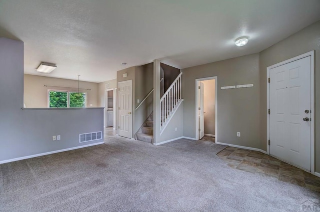 6292 Riverdale Dr, Colorado Springs, CO 80923 - spare room with carpet flooring and stairs