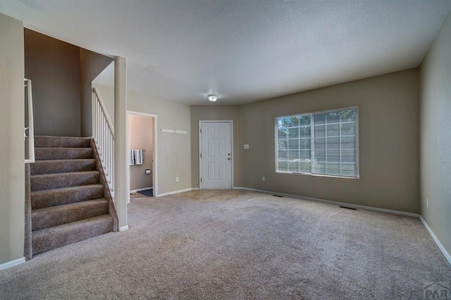 6292 Riverdale Dr, Colorado Springs, CO 80923 - foyer featuring carpet flooring and stairs