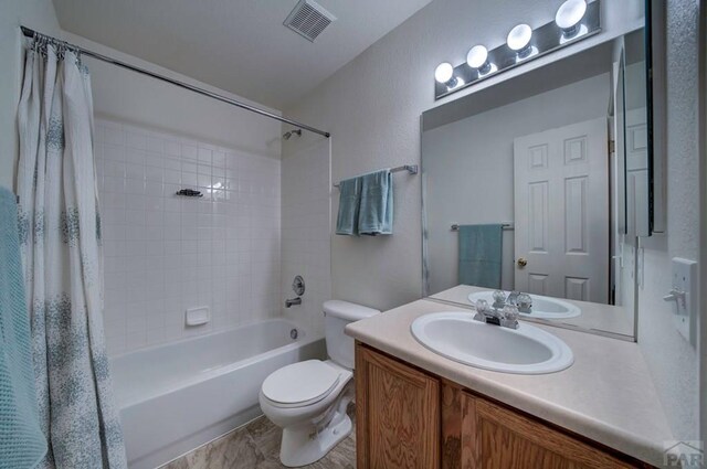 6292 Riverdale Dr, Colorado Springs, CO 80923 - bathroom featuring shower / bath combo and vanity