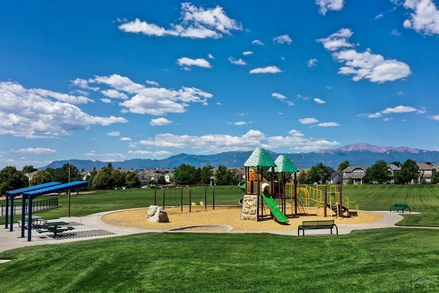6292 Riverdale Dr, Colorado Springs, CO 80923 - community jungle gym featuring a mountain view and a lawn
