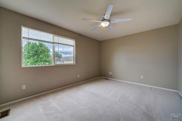 6292 Riverdale Dr, Colorado Springs, CO 80923 - unfurnished room featuring light carpet, plenty of natural light, and ceiling fan