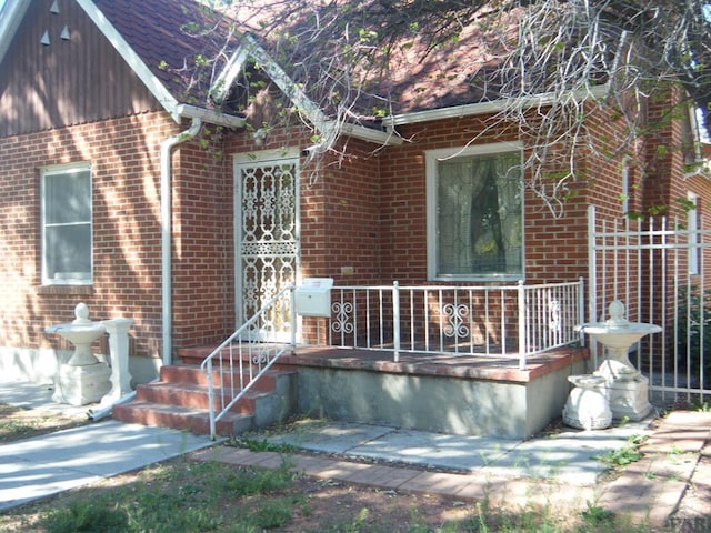 exterior space featuring brick siding