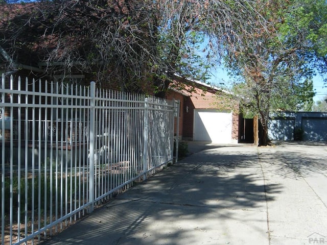 view of gate featuring fence