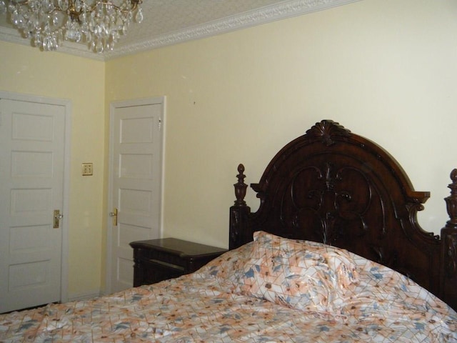 bedroom featuring a notable chandelier