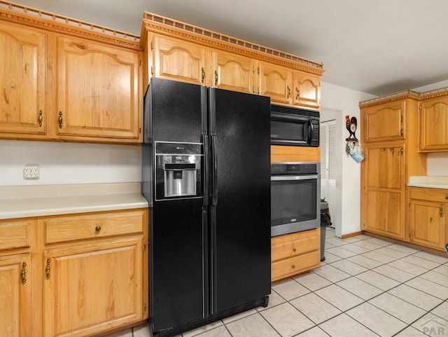 1505 Center Ln, Pueblo, CO 81006 - kitchen featuring black appliances, light countertops, and light tile patterned floors