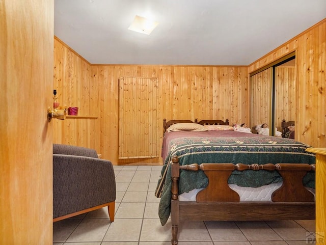 1505 Center Ln, Pueblo, CO 81006 - tiled bedroom featuring wood walls