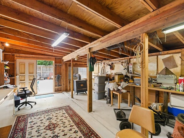 1505 Center Ln, Pueblo, CO 81006 - below grade area featuring a wood stove and a desk