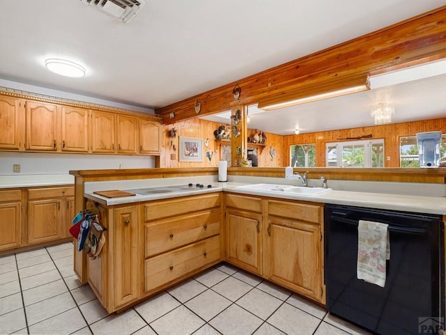 1505 Center Ln, Pueblo, CO 81006 - kitchen featuring black dishwasher, light countertops, and light tile patterned floors