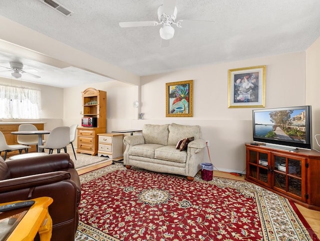 1505 Center Ln, Pueblo, CO 81006 - living area with ceiling fan and a textured ceiling