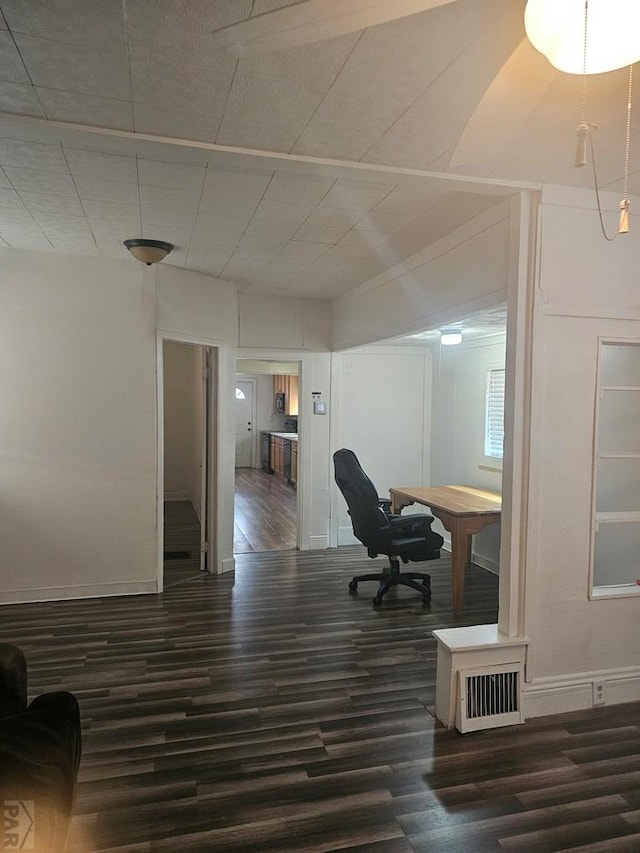 office space featuring visible vents, dark wood finished floors, and baseboards