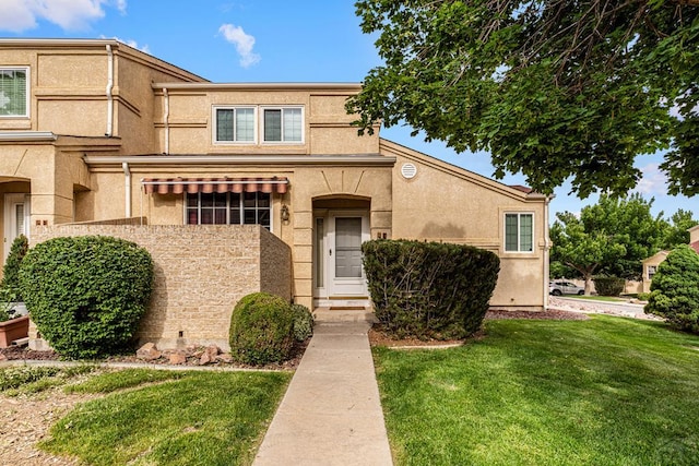 4141 Outlook Blvd Unit Q, Pueblo, CO 81008 - view of front of property with a front lawn and stucco siding