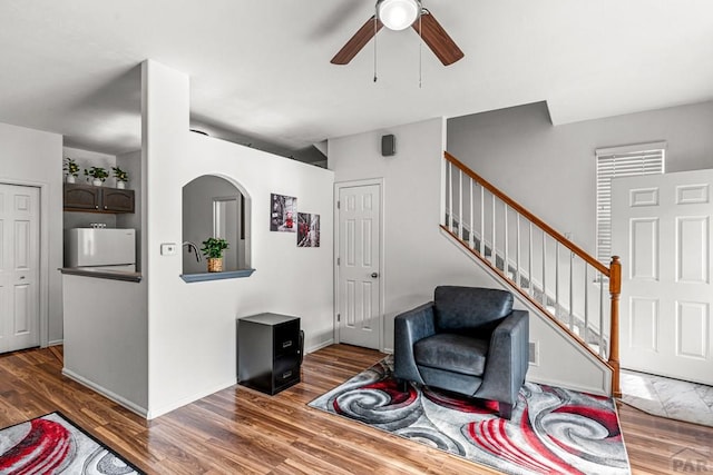 4141 Outlook Blvd Unit Q, Pueblo, CO 81008 - living room with a ceiling fan, stairway, and wood finished floors
