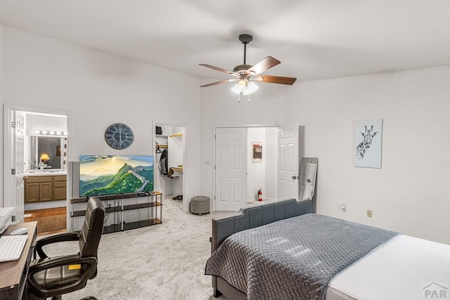 4141 Outlook Blvd Unit Q, Pueblo, CO 81008 - bedroom featuring carpet floors, a walk in closet, high vaulted ceiling, ceiling fan, and ensuite bathroom