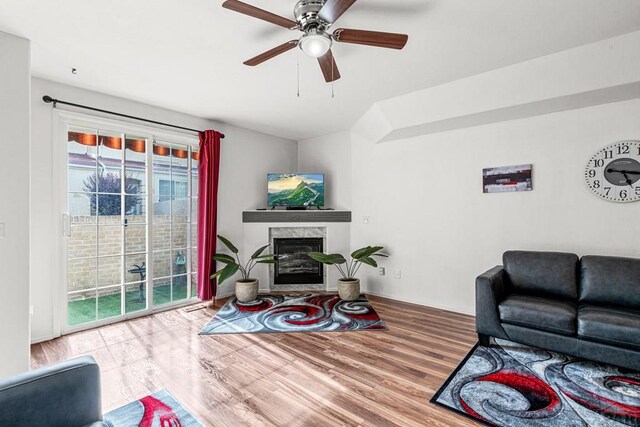 4141 Outlook Blvd Unit Q, Pueblo, CO 81008 - living room with wood finished floors, a high end fireplace, and ceiling fan