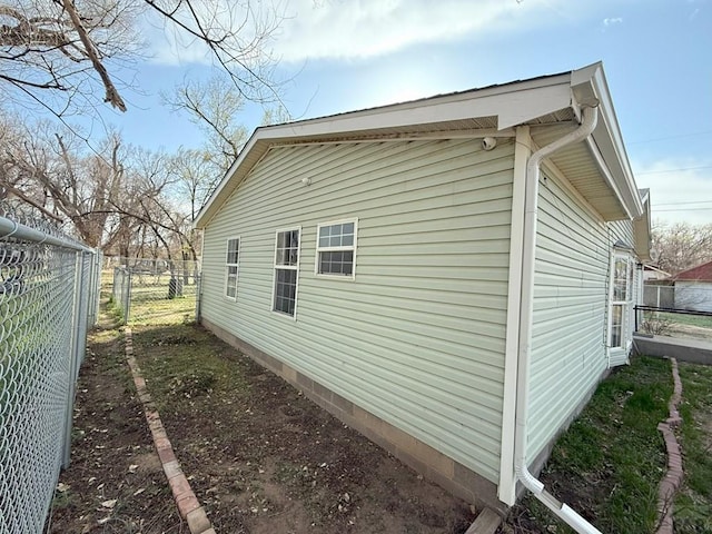 view of home's exterior with fence