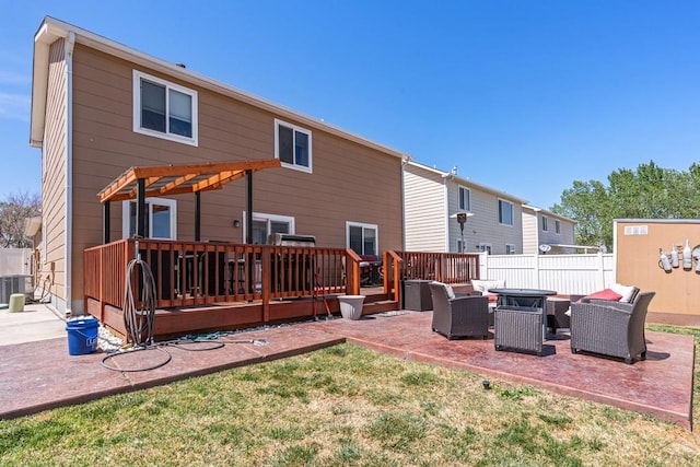 rear view of property with fence, a pergola, a deck, a patio, and an outdoor hangout area