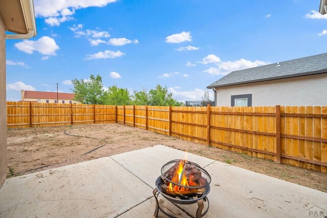 2337 Cruz Ct, Pueblo, CO 81003 - view of patio / terrace featuring an outdoor fire pit and a fenced backyard