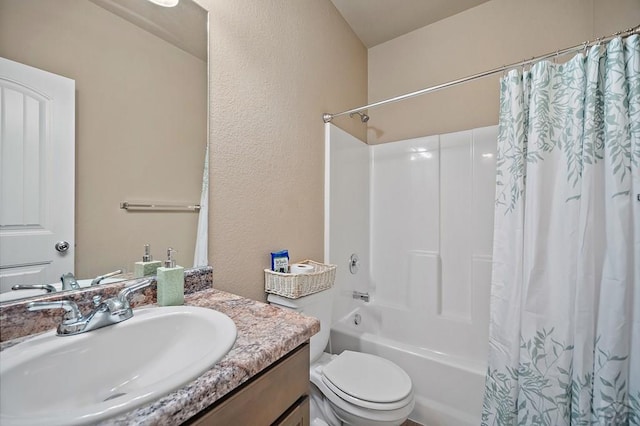 2337 Cruz Ct, Pueblo, CO 81003 - full bathroom with vanity, shower / bathtub combination with curtain, a textured wall, and toilet