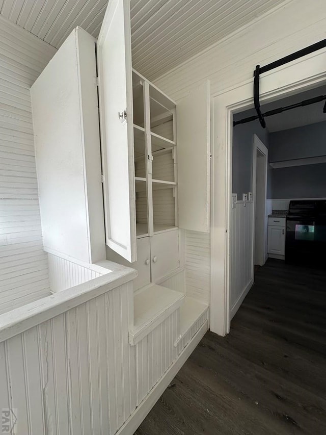 mudroom with dark wood finished floors