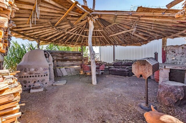 view of patio / terrace featuring an outdoor structure and an exterior structure