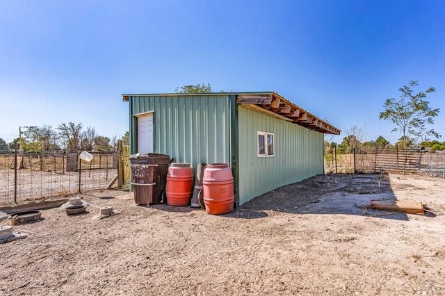 view of outdoor structure with fence