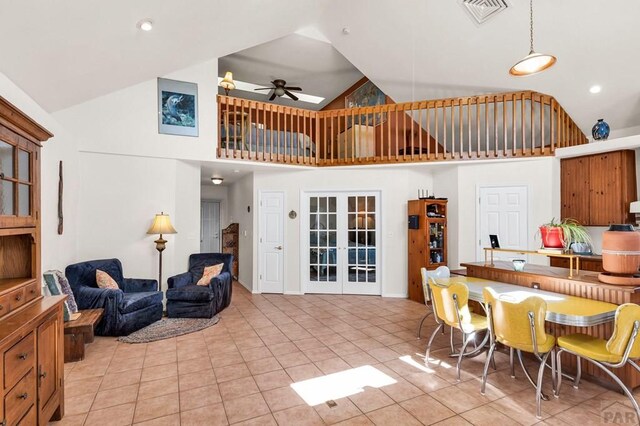 interior space with visible vents, a ceiling fan, open floor plan, french doors, and light tile patterned flooring