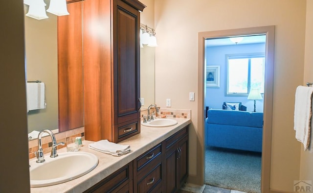 bathroom featuring double vanity and a sink