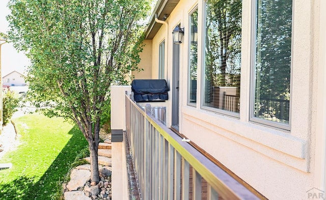 view of side of property with a balcony