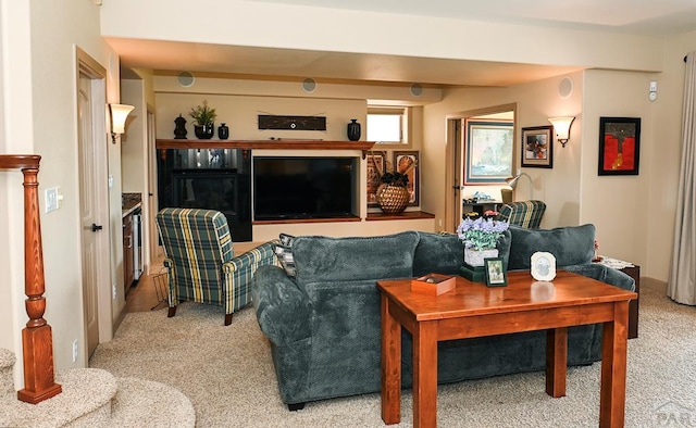 living area featuring light carpet