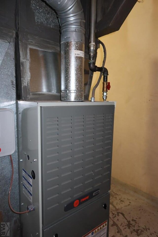 utility room with heating unit