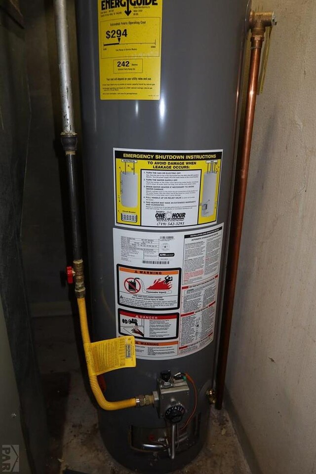 utility room with water heater