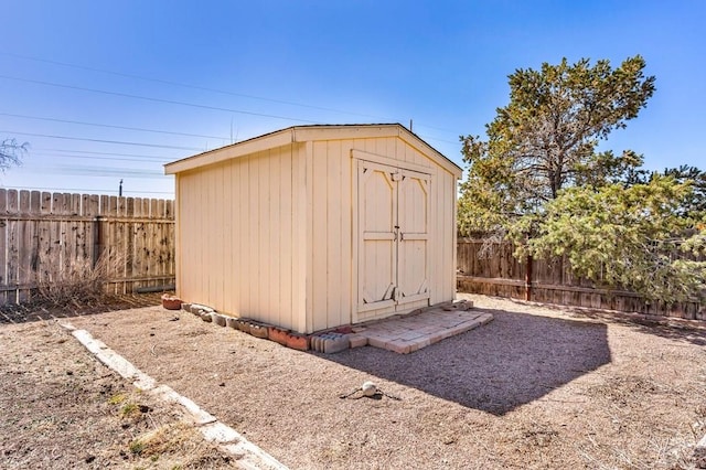 view of shed with a fenced backyard