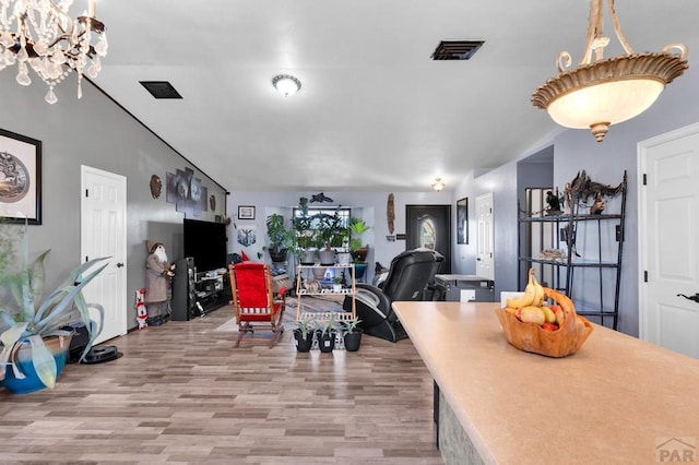 dining space with visible vents and light wood-style flooring