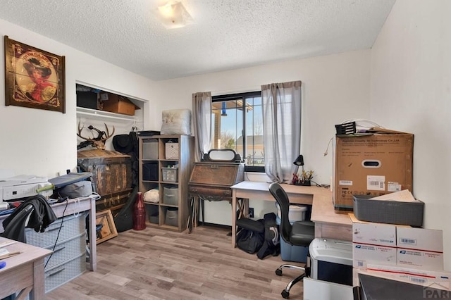 office space featuring a textured ceiling and wood finished floors