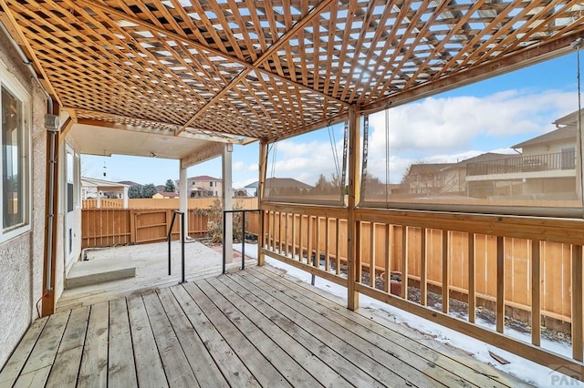 deck with fence and a pergola