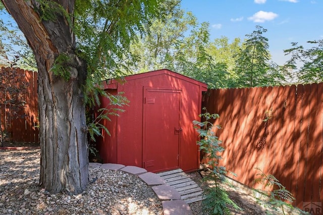 view of shed featuring a fenced backyard