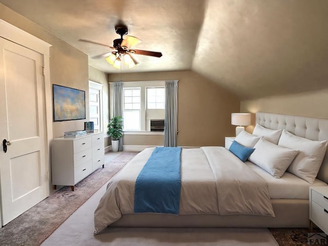 519 Broadway Ave, Pueblo, CO 81004 - bedroom featuring a ceiling fan, light carpet, and vaulted ceiling