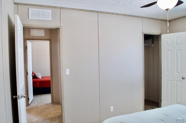 bedroom featuring light carpet and visible vents