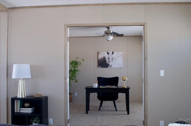 office featuring ceiling fan and light colored carpet