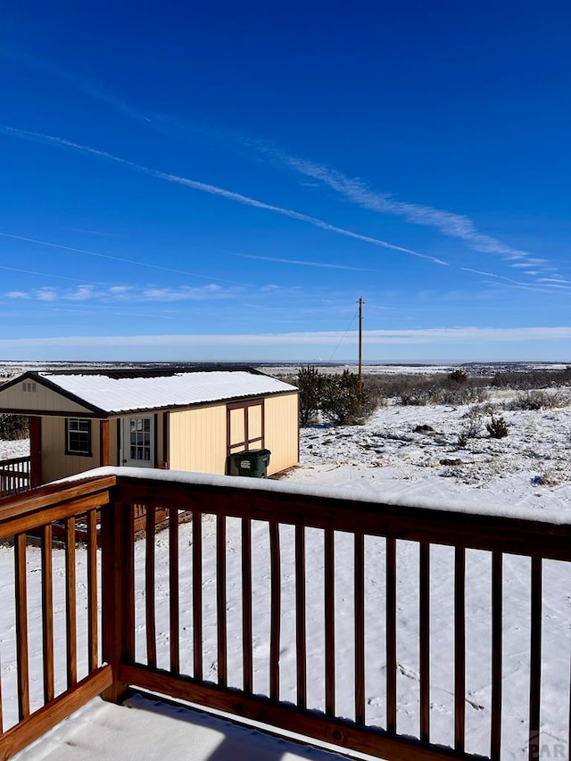 view of snow covered deck