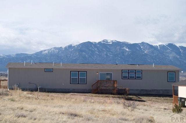 rear view of property featuring a mountain view