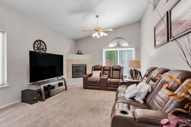 living room with lofted ceiling, ceiling fan, visible vents, and light colored carpet